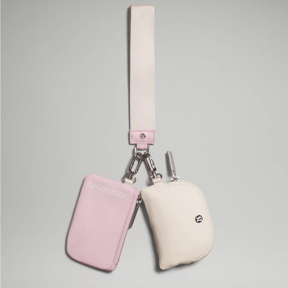 lululemon dual pouch wristlet. Flaw on logo on white pouch CHECK PICS